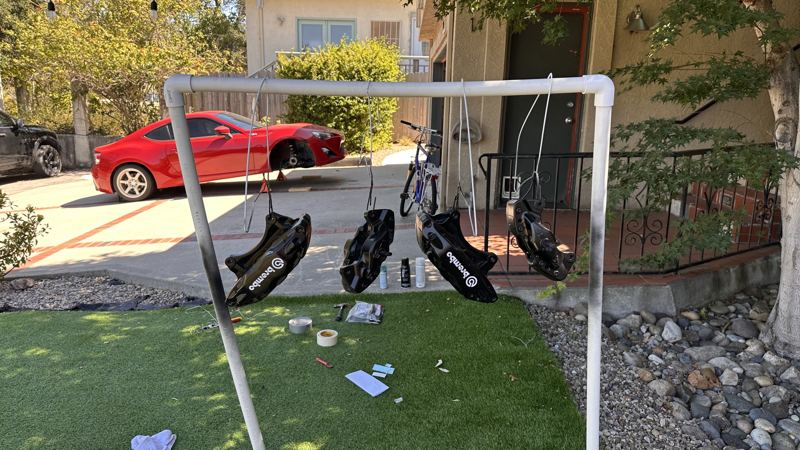 wheels hanging to dry in the backyard